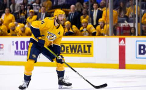 NASHVILLE, TN – FEBRUARY 21: Mattias Ekholm #14 of the Nashville Predators controls the puck against the Vancouver Canucks during the first period at Bridgestone Arena on February 21, 2023 in Nashville, Tennessee. (Photo by Brett Carlsen/Getty Images)