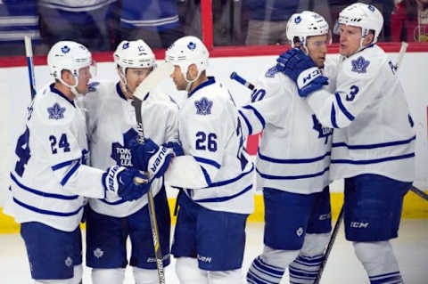 Feb 6, 2016; Ottawa, Ontario, CAN; The Toronto Maple Leafs celebrate a goal scored by right wing Pierre-Alexandre Parenteau (15) in the third period against the Ottawa Senators at the Canadian Tire Centre. The Senators defeated the Maple Leafs 6-1. Mandatory Credit: Marc DesRosiers-USA TODAY Sports