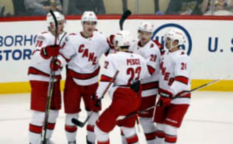 Nov 29, 2022; Pittsburgh, Pennsylvania, USA; Carolina Hurricanes center Martin Necas (second from left) celebrates his goal with teammates defensemen Brady Skjei (76) and Brett Pesce (22) and forwards Sebastian Aho (20) and Seth Jarvis (24) against the Pittsburgh Penguins during the second period at PPG Paints Arena. Mandatory Credit: Charles LeClaire-USA TODAY Sports