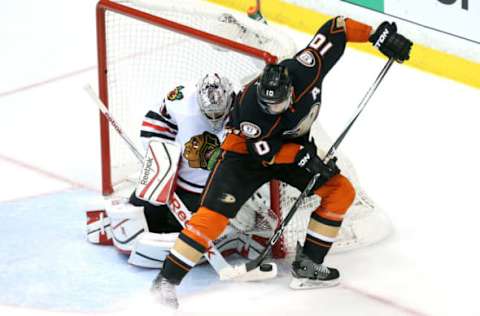 ANAHEIM, CA: Corey Perry #10 of the Anaheim Ducks with the puck against Corey Crawford #50 of the Chicago Blackhawks in the first period in Game Seven of the 2015 Western Conference Finals on May 30, 2015. (Photo by Stephen Dunn/Getty Images)