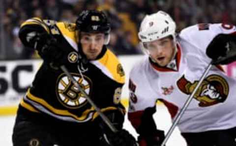 Mar 21, 2017; Boston, MA, USA; Boston Bruins left wing Brad Marchand (63) and Ottawa Senators right wing Bobby Ryan (9) battle for position after a face-off during the second period at TD Garden. Mandatory Credit: Bob DeChiara-USA TODAY Sports