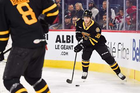 LAVAL, QC – OCTOBER 16: Providence Bruins defenceman Jakub Zboril (38) skates in control of the puck in the far end of his zone during the Providence Bruins versus the Laval Rocket game on October 16, 2019, at Place Bell in Laval, QC (Photo by David Kirouac/Icon Sportswire via Getty Images)