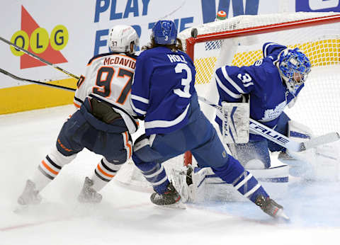 Jan 20, 2021; Toronto, Ontario, CAN; Edmonton Oilers forward Connor McDavid (97) hits the crossbar as Toronto Maple Leafs   Mandatory Credit: Dan Hamilton-USA TODAY Sports