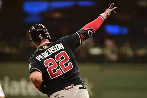 Oct 8, 2021; Milwaukee, Wisconsin, USA; Atlanta Braves left fielder Joc Pederson (22) celebrates he runs the bases after hitting a solo home run in the eighth inning against the Milwaukee Brewers during game one of the 2021 NLDS at American Family Field. Mandatory Credit: Benny Sieu-USA TODAY Sports