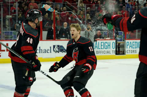 RALEIGH, NC – FEBRUARY 15: Warren Foegele #13 of the Carolina Hurricanes celebrates during the team Storm Surge following a victory over the Edmonton Oilers during an NHL game on February 15, 2019 at PSNC Arena in Raleigh, North Carolina. (Photo by Gregg Forwerck/NHLI via Getty Images)