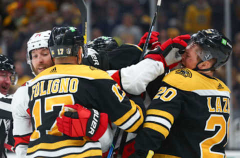 BOSTON, MA – MAY 08: Tony DeAngelo #77 of the Carolina Hurricanes pushes Curtis Lazar #20 of the Boston Bruins in the third period in Game Four of the First Round of the 2022 Stanley Cup Playoffs at TD Garden on May 8, 2022 in Boston, Massachusetts. (Photo by Adam Glanzman/Getty Images)