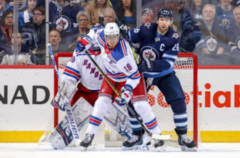 WINNIPEG, MB – FEBRUARY 12: Marc Staal #18 of the New York Rangers and Blake Wheeler #26 of the Winnipeg Jets battle in front of the net during third period action at the Bell MTS Place on February 12, 2019 in Winnipeg, Manitoba, Canada. (Photo by Jonathan Kozub/NHLI via Getty Images)