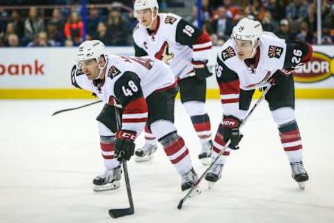 Jan 2, 2016; Edmonton, Alberta, CAN; Arizona Coyotes left wing Jordan Martinook (48) and Arizona Coyotes defenseman Michael Stone (26) against the Edmonton Oilers during the third period at Rexall Place. Edmonton Oilers won 4-3. Mandatory Credit: Sergei Belski-USA TODAY Sports