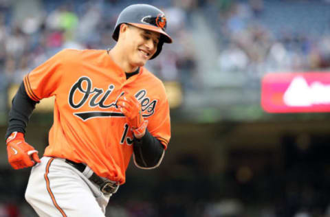 Oct 1, 2016; Bronx, NY, USA; Baltimore Orioles third baseman Manny Machado (13) rounds the bases on his solo home run during the third inning against the New York Yankees at Yankee Stadium. Mandatory Credit: Anthony Gruppuso-USA TODAY Sports