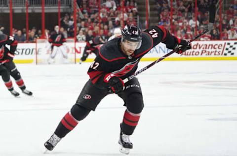 RALEIGH, NC – APRIL 18: Carolina Hurricanes center Greg McKegg (42) chases down a loose puck during a game between the Carolina Hurricanes and the Washington Capitals on April 18, 2019, at the PNC Arena in Raleigh, NC. (Photo by Greg Thompson/Icon Sportswire via Getty Images)