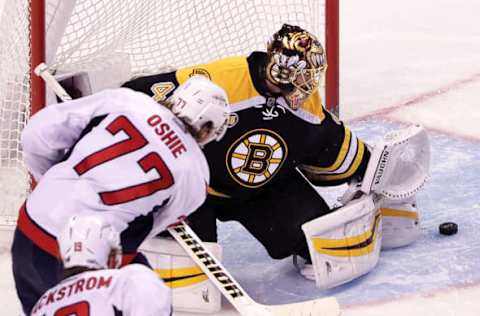 BOSTON – APRIL 8: Boston Bruins goalie Tuukka Rask (40) turns away a shot by Washington Capitals right wing T.J. Oshie (77) in the third period. The Boston Bruins host the Washington Capitals in the regular-season finale at TD Garden in Boston on Apr. 8, 2017. (Photo by Barry Chin/The Boston Globe via Getty Images)