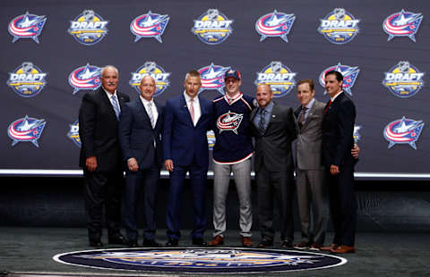 Jun 24, 2016; Buffalo, NY, USA; Pierre-Luc Dubois poses for a photo with team officials after being selected as the number three overall draft pick by the Columbus Blue Jackets in the first round of the 2016 NHL Draft at the First Niagra Center. Mandatory Credit: Timothy T. Ludwig-USA TODAY Sports