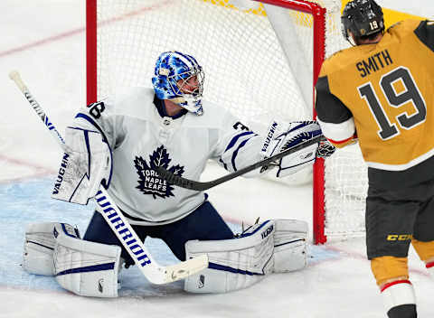 Jan 11, 2022; Las Vegas, Nevada, USA; Toronto Maple Leafs goaltender Jack Campbell (36) makes a glove save with Vegas Golden Knights right wing Reilly Smith (19) looking for a rebound during the third period at T-Mobile Arena. Mandatory Credit: Stephen R. Sylvanie-USA TODAY Sports