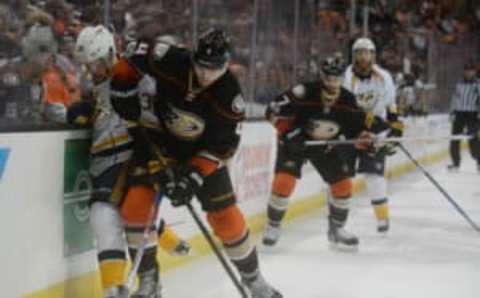 Anaheim Ducks defenseman Cam Fowler (4) plays for the puck (Gary A. Vasquez-USA TODAY Sports)