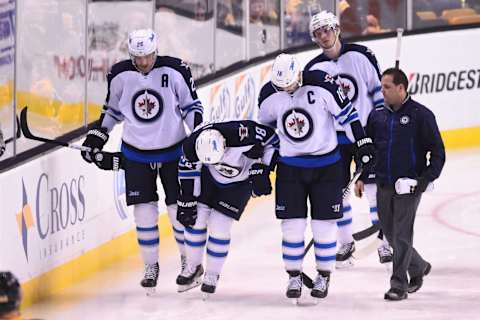 BOSTON, MA – NOVEMBER 28 : Bryan Little #18 of the Winnipeg Jets leaves the ice with an injury during the third period against the Boston Bruins at the TD Garden on November 28, 2014 in Boston, Massachusetts. (Photo by Steve Babineau/NHLI via Getty Images)