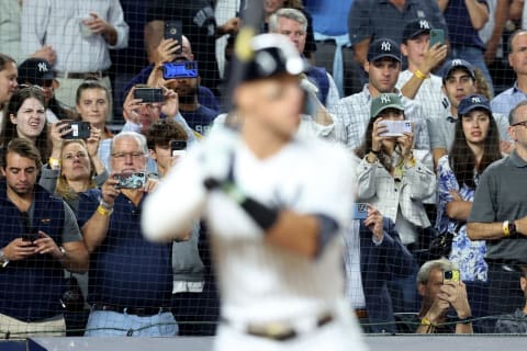 Sep 21, 2022; Bronx, New York, USA; Fans take photos on their smart phones as New York Yankees right fielder Aaron Judge (99) bats against the Pittsburgh Pirates during the seventh inning at Yankee Stadium. Mandatory Credit: Brad Penner-USA TODAY Sports