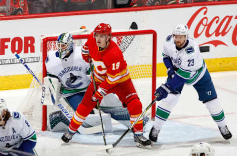 CALGARY, AB – DECEMBER 29: Matthew Tkachuk #19 of the Calgary Flames skates against Alex Edler #23 of the Vancouver Canucks during an NHL game on December 29, 2018 at the Scotiabank Saddledome in Calgary, Alberta, Canada. (Photo by Gerry Thomas/NHLI via Getty Images)