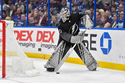 TAMPA, FL – MARCH 09: Tampa Bay Lightning goalie Louis Domingue (70) plays the puck during the second period of an NHL game between the Detroit Red Wings and the Tampa Bay Lightning on March 09, 2019 at Amalie Arena in Tampa, FL. (Photo by Roy K. Miller/Icon Sportswire via Getty Images)