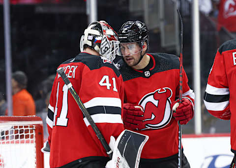 New Jersey Devils Vitek Vanecek celebrates with Brendan Smith: Vincent Carchietta-USA TODAY Sports