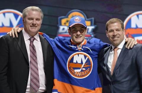 CHL Player Rankings: Mathew Barzal poses with team executives after being selected as the number sixteen overall pick to the New York Islanders in the first round of the 2015 NHL Draft at BB&T Center. Mandatory Credit: Steve Mitchell-USA TODAY Sports