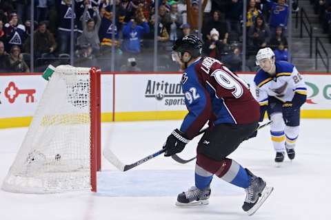 Jan 6, 2016; Denver, CO, USA; Colorado Avalanche left wing Gabriel Landeskog (92) scores the game winning goal during the overtime period against the St. Louis Blues at Pepsi Center. The Avs won 4-3 in overtime. Mandatory Credit: Chris Humphreys-USA TODAY Sports