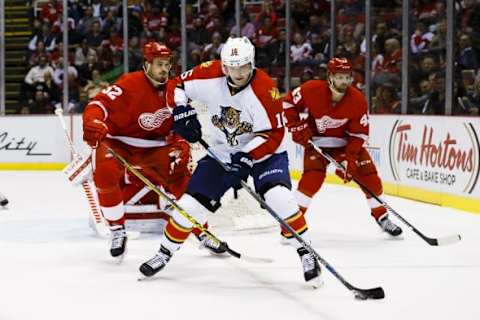 Feb 8, 2016; Detroit, MI, USA; Florida Panthers center Aleksander Barkov (16) skates with the puck defended by Detroit Red Wings defenseman Jonathan Ericsson (52) in the first period at Joe Louis Arena. Mandatory Credit: Rick Osentoski-USA TODAY Sports