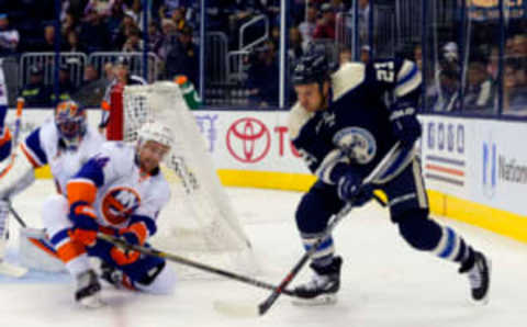 Oct 20, 2015; Columbus, OH, USA; Columbus Blue Jackets right wing David Clarkson (23) controls the puck as New York Islanders defenseman Calvin de Haan (44) defends during the second period at Nationwide Arena. Mandatory Credit: Russell LaBounty-USA TODAY Sports