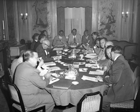 Spinning the Wheels at Baseball’s Round TableMajor league club representatives gather at Waldorf-Astoria to screen candidates for baseball commissioner: (clockwise from lower left) Walter O’Malley (Dodgers), Fred Saigh (Cards, hidden), Warren Giles (Reds), Charles Comiskey (Chisox), Spike Briggs (Tigers, hidden), Phil Wrigley (Cubs), Lou Perini (Braves), Del Webb (Yanks), Ellis Ryan (Indians), Tom Yawkey (Bosox), Horace Stoneham (Giants, partly hidden), Dan Topping (Yanks), Cal Griffith (Senators), Roy Mack (A’s), Billy De-Witt (Browns) and Branch Rickey (Pirates). Bob Carpenter (Phils) was absent when picture was taken.(Photo By: Buckley, Arthur/NY Daily News via Getty Images)