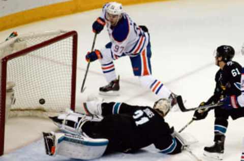 Apr 6, 2017; San Jose, CA, USA; Edmonton Oilers center Connor McDavid (97) watches the puck go into the goal against San Jose Sharks goalie Martin Jones (31) during the second period at SAP Center at San Jose. Mandatory Credit: Stan Szeto-USA TODAY Sports