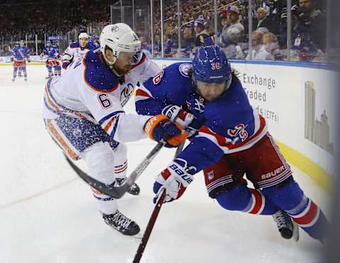 NEW YORK, NY – NOVEMBER 03: Mats Zuccarello #36 of the New York Rangers is checked by Adam Larsson #6 of the Edmonton Oilers during the second period at Madison Square Garden on November 3, 2016 in New York City. (Photo by Bruce Bennett/Getty Images)