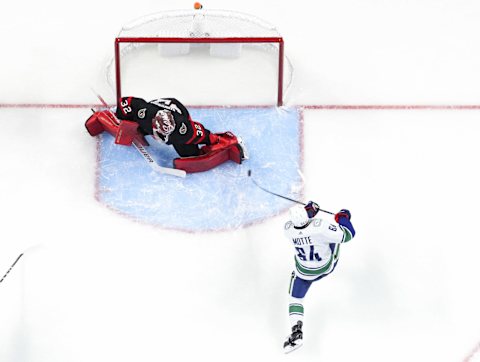 OTTAWA, ONTARIO – DECEMBER 01: Tyler Motte #64 of the Vancouver Canucks scores on Filip Gustavsson #32 of the Ottawa Senators during the second period at Canadian Tire Centre on December 01, 2021 in Ottawa, Ontario. (Photo by Chris Tanouye/Getty Images)