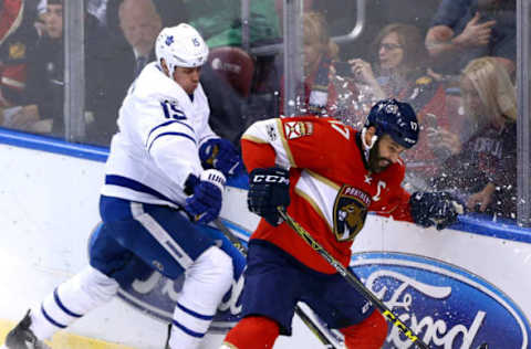 Mar 14, 2017; Sunrise, FL, USA; Florida Panthers center Derek MacKenzie (17) and Toronto Maple Leafs left wing Matt Martin (15) battle for the puck in the third period at BB&T Center. The Panthers won 7-2. Mandatory Credit: Robert Mayer-USA TODAY Sports