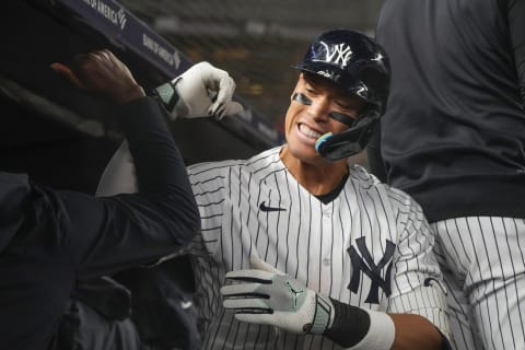 May 23, 2023; Bronx, New York, USA; New York Yankees right fielder Aaron Judge (99) is congratulated by teammates for hitting a home run against the Baltimore Orioles during the ninth inning at Yankee Stadium. Mandatory Credit: Gregory Fisher-USA TODAY Sports