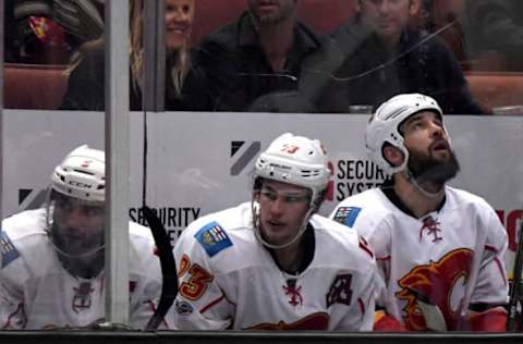 Apr 4, 2017; Anaheim, CA, USA; Calgary Flames defenseman Mark Giordano (5), center Sean Monahan (23) and defenseman Deryk Engelland (29) sit in the penalty box in the third period during a NHL hockey game against the Anaheim Ducks at Honda Center.The Ducks defeated the Flames 3-1. Mandatory Credit: Kirby Lee-USA TODAY Sports