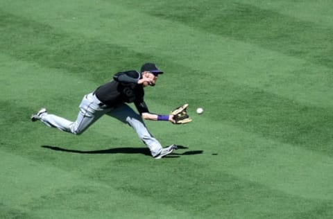 Sep 11, 2016; San Diego, CA, USA; Colorado Rockies left fielder David Dahl (26) makes a catch on a ball hit by San Diego Padres first baseman Wil Myers (not pictured) during the fourth inning at Petco Park. Mandatory Credit: Jake Roth-USA TODAY Sports. MLB.