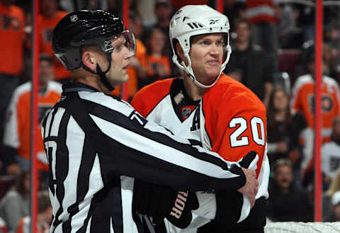 Chris Pronger being restrained by linesman Tim Nowak during his Flyers tenure. (Photo by Jim McIsaac/Getty Images)