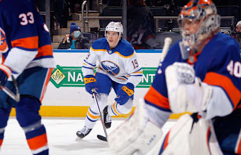 ELMONT, NEW YORK – DECEMBER 30: Peyton Krebs #19 of the Buffalo Sabres skates against the New York Islanders during the third period at the UBS Arena on December 30, 2021 in Elmont, New York. (Photo by Bruce Bennett/Getty Images)