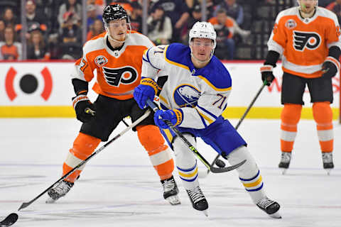 Apr 1, 2023; Philadelphia, Pennsylvania, USA; Buffalo Sabres left wing Victor Olofsson (71) carries the puck past Philadelphia Flyers right wing Wade Allison (57) at Wells Fargo Center. Mandatory Credit: Eric Hartline-USA TODAY Sports