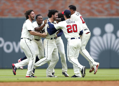 ATLANTA, GA – MAY 20: Teammates mob Dansby Swanson #7 (C) of the Atlanta Braves after he hit a two-run, game-winning walk-off single in the ninth inning during the game against the Miami Marlins at SunTrust Park on May 20, 2018, in Atlanta, Georgia. (Photo by Mike Zarrilli/Getty Images)