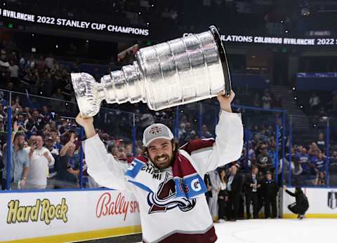 Alex Newhook hoists the Stanley Cup after defeating Tampa Bay in Game 6. (Photo by Bruce Bennett/Getty Images)