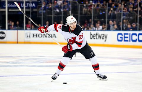 Apr 29, 2023; New York, New York, USA; New Jersey Devils defenseman Damon Severson (28) takes a shot against the New York Rangers during the third period in game six of the first round of the 2023 Stanley Cup Playoffs at Madison Square Garden. Mandatory Credit: Danny Wild-USA TODAY Sports