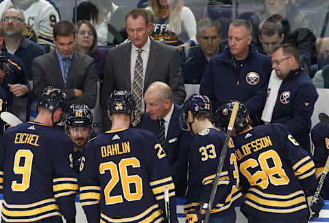 BUFFALO, NY – OCTOBER 09: Buffalo Sabres head coach Ralph Krueger (center) discusses power play options with Jack Eichel #9 of the Buffalo Sabres, Rasmus Dahlin #26, Colin Miller #33, and Victor Olofsson #68 late in the third period at KeyBank Center on October 9, 2019 in Buffalo, New York. (Photo by Nicholas T. LoVerde/Getty Images)