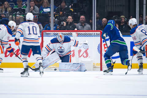 VANCOUVER, CANADA – OCTOBER 11: Brock Boeser #6 of the Vancouver Canucks scores his third goal on Jack Campbell #36 of the Edmonton Oilers during the second period of their NHL game at Rogers Arena on October 11, 2023 in Vancouver, British Columbia, Canada. (Photo by Derek Cain/Getty Images)