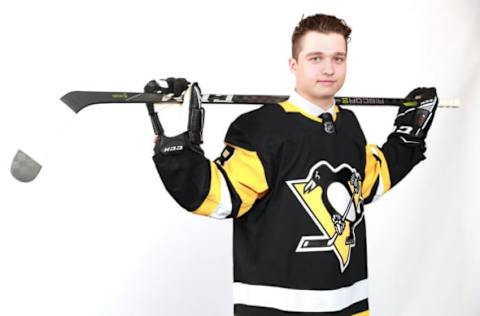 DALLAS, TX – JUNE 23: Calen Addison poses after being selected 53rd overall by the Pittsburgh Penguins during the 2018 NHL Draft at American Airlines Center on June 23, 2018 in Dallas, Texas. (Photo by Tom Pennington/Getty Images)