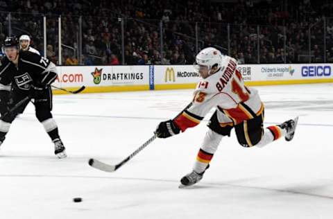 Apr 6, 2017; Los Angeles, CA, USA; Calgary Flames left wing Johnny Gaudreau (13) shoots the puck against the Los Angeles Kings during a NHL hockey game at Staples Center. The Flames defeated the Kings 4-1. Mandatory Credit: Kirby Lee-USA TODAY Sports