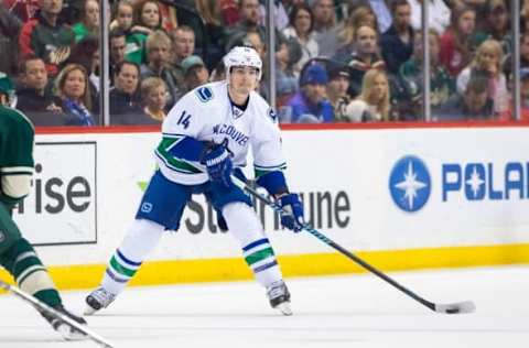 Nov 25, 2015; Saint Paul, MN, USA; Vancouver Canucks forward Alex Burrows (14) skates with the puck in the first period against the Minnesota Wild at Xcel Energy Center. Mandatory Credit: Brad Rempel-USA TODAY Sports