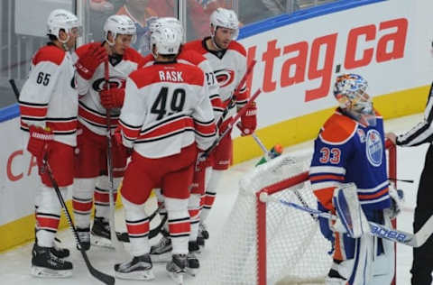 NHL Power Rankings: The Carolina Hurricanes players celebrate after a goal against Edmonton Oilers oalie Cam Talbot (33) during the third period at Rogers Place. The Oiles won 3-2. Mandatory Credit: Walter Tychnowicz-USA TODAY Sports