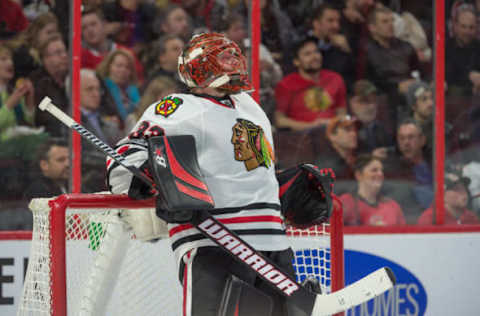 Mar 16, 2017; Ottawa, Ontario, CAN; Chicago Blackhawks goalie Scott Darling (33) takes a break during the second period against the Ottawa Senators at the Canadian Tire Centre. The Blackhawks defeated the Senators 2-1. Mandatory Credit: Marc DesRosiers-USA TODAY Sports