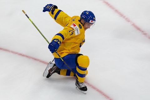 EDMONTON, AB – DECEMBER 30: Arvid Costmar #14 of Sweden celebrates his goal against Russia during the 2021 IIHF World Junior Championship at Rogers Place on December 30, 2020 in Edmonton, Canada. (Photo by Codie McLachlan/Getty Images)