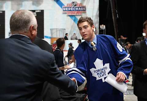 MONTREAL , QC – JUNE 27: Jesse Blacker greets team representatives after being drafted by the Toronto Maple Leafs during the second day of the 2009 NHL Entry Draft at the Bell Centre on June 27, 2009 in Montreal, Quebec, Canada. (Photo by Bruce Bennett/Getty Images)